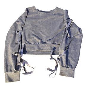 Grey cropped sweatshirt with tie sleeves to make bows cute and simple